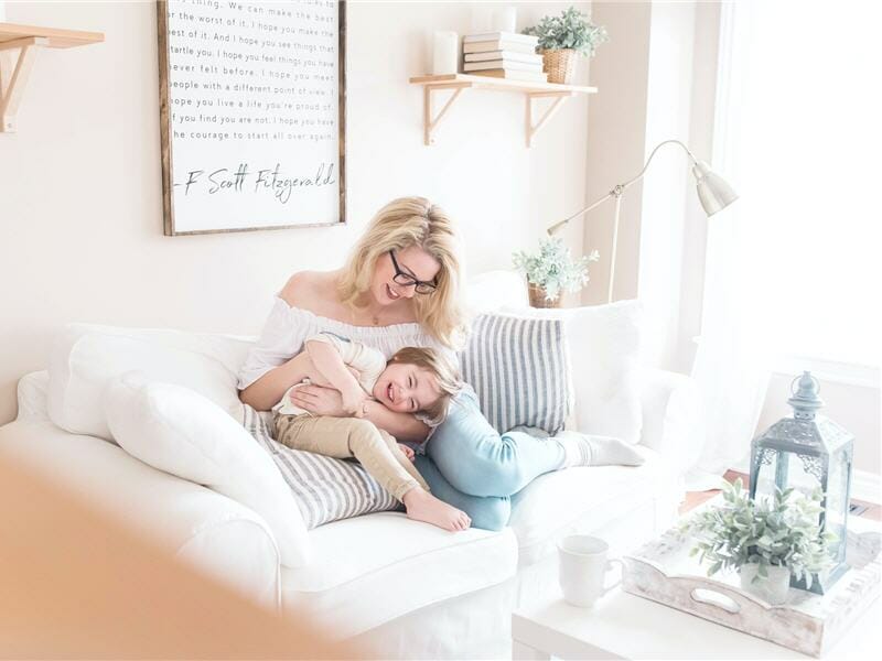 Mother and child in white sofa